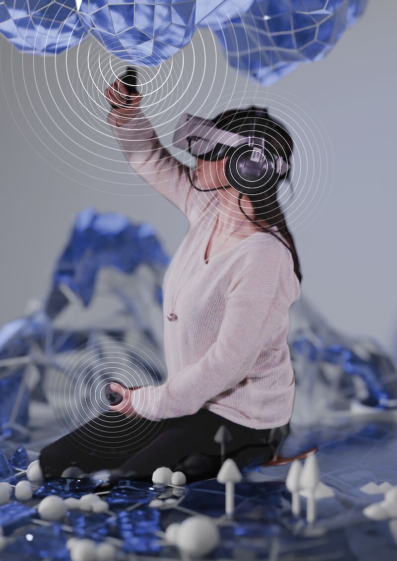 A visualization showing a blind user interacting with the virtual cloud within the VR experience and receiving multi-sensory feedback.